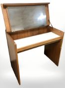 A Stag teak mirror back dressing table with hinged lid, and a further four drawer pedestal,