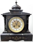 A Victorian black slate and marble eight day mantel clock, retailed by Wm.