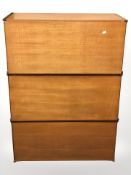 Three teak fall front cabinets, each 81 cm wide.