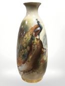 A Royal Worcester vase, shape 2491, hand-painted with a peacock and hen on branches,