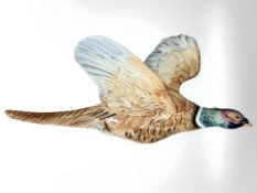 A Beswick pheasant in flight No. 661/1, length 31 cm.