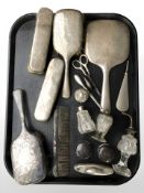 A group of silver backed dressing table brushes and hand mirror, various pots, atomiser, etc.