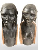 A pair of African carved wooden busts,
