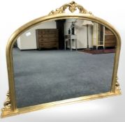 A reproduction gilt over mantel mirror,