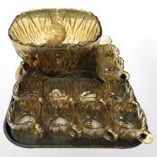 An amber glass punch bowl and cups.