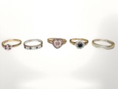 Five 9ct gold rings set with diamonds,