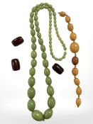 A group of amber/Bakelite beads