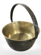 A Victorian brass and wrought iron jam pan.