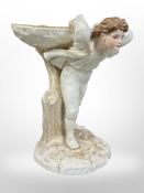 A Royal Worcester compote modelled as a boy carrying a woven basket, shape number 962,