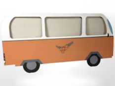 A large painted plywood cut out of a camper van,