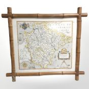 A reproduction Saxton's map of Devonshire, 1575, in bamboo frame, overall 67 cm x 61 cm.
