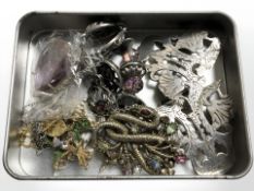 A nurse's buckle and a small group of costume jewellery, coloured gemstone pendant, etc.