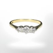 An 18ct gold three stone diamond ring, size N CONDITION REPORT: 2.