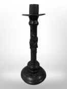 A Chinese bronze candlestick, height 25cm.