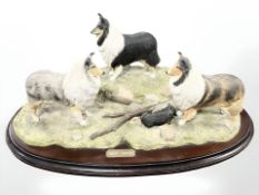 A Naturecraft figure group 'Three's Company', on wooden plinth, width 50 cm.