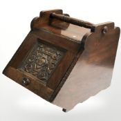 A Victorian carved oak coal receiver, width 35 cm.