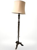 A mahogany tripod standard lamp,