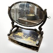A 1920' chinoiserie oval dressing table mirror fitted with three drawers,