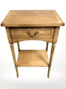 A reproduction yew wood single drawer table, width 46 cm.