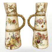 A pair of Royal Worcester jugs decorated with floral sprays, date code for 1902, 20cm high.