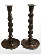 A pair of antique oak barley twist candlesticks, height 30 cm.