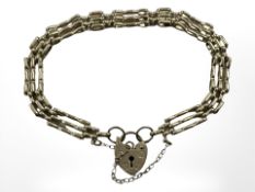 A 9ct gold padlock bracelet CONDITION REPORT: 8.