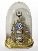 A 19th century French gilt metal porcelain and enamel mantel clock, with pendulum and key,