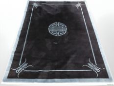 A Chinese rug on indigo ground,