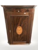 A 19th century inlaid mahogany corner cabinet, height 101 cm.