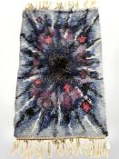 A 1970's shaggy pile rug,