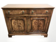 A reproduction mahogany side cabinet,