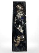 A group of costume brooches and bangles.