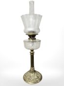 A Victorian brass Youngs Special oil lamp with columnar support, clear glass reservoir,