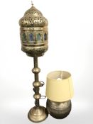 An Islamic brass lantern wired for electricity with stained glass panels and a further bulbous