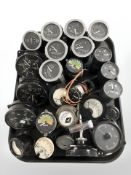 A collection of gauges including volt metres, speedometers measuring knots,