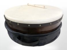A Bodran drum with beater and soft carry bag, diameter 46 cm.