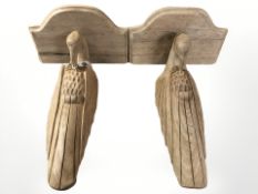 A pair of carved oak Art Deco style wall brackets modelled as birds,