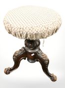 A Victorian circular piano stool