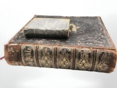 A Victorian leather bound Holy Bible and a smaller example.