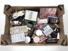 A quantity of makeup and beauty products.