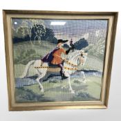 A needlework tapestry depicting a figure on horseback, 54 cm x 57 cm.