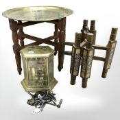 Two eastern folding table bases, one with engraved brass top,