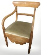 A 20th century walnut armchair.