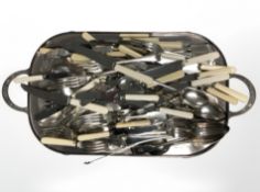 An EPNS twin handled serving tray on claw and ball feet,