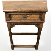 A 20th century oak single drawer side table,