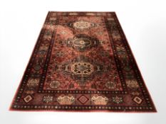 A machine made carpet of Afghan design,