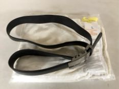 A pair of new Pacific Merchants jogging bottoms, size L, and a black leather belt.