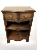 A mahogany serpentine front side table, fitted two drawers, width 52 cm.