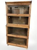 An Edwardian Globe-Wernicke style glazed oak four height stacking bookcase,