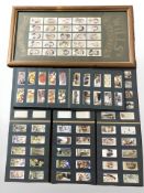 A quantity of Wills cigarette cards in albums and a framed montage.